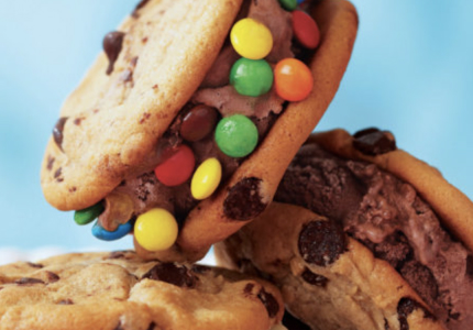 chocolate chip ice cream cookie sandwich with chocolate ice cream and candy-coated chocolates around edges