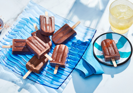 blue platter of mexican-inspired ice pops with tajin seasoning