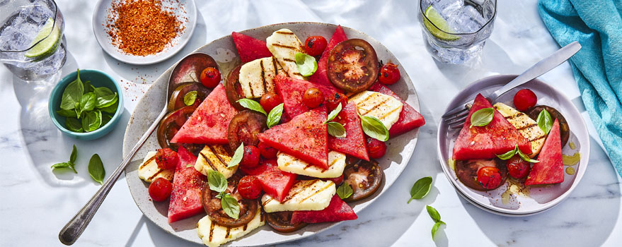 white serving platter of Grilled Halloumi Cheese, Watermelon and Tomato Salad